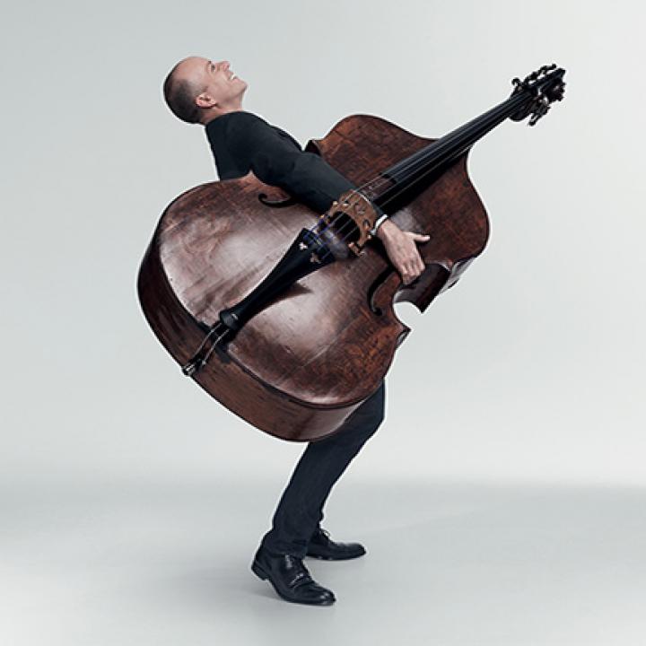 man carrying bass